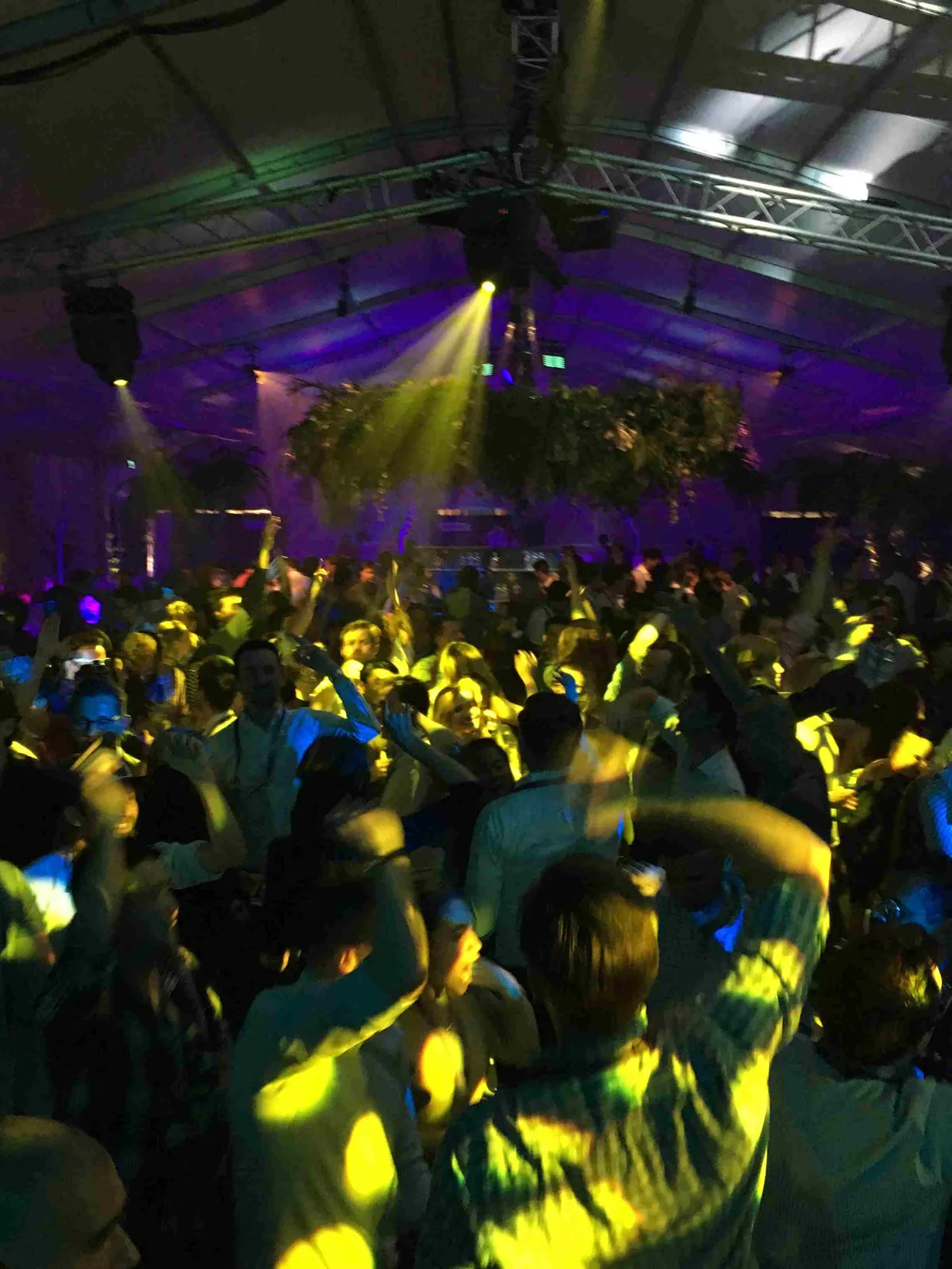 Private party DJ set under marquee lighting