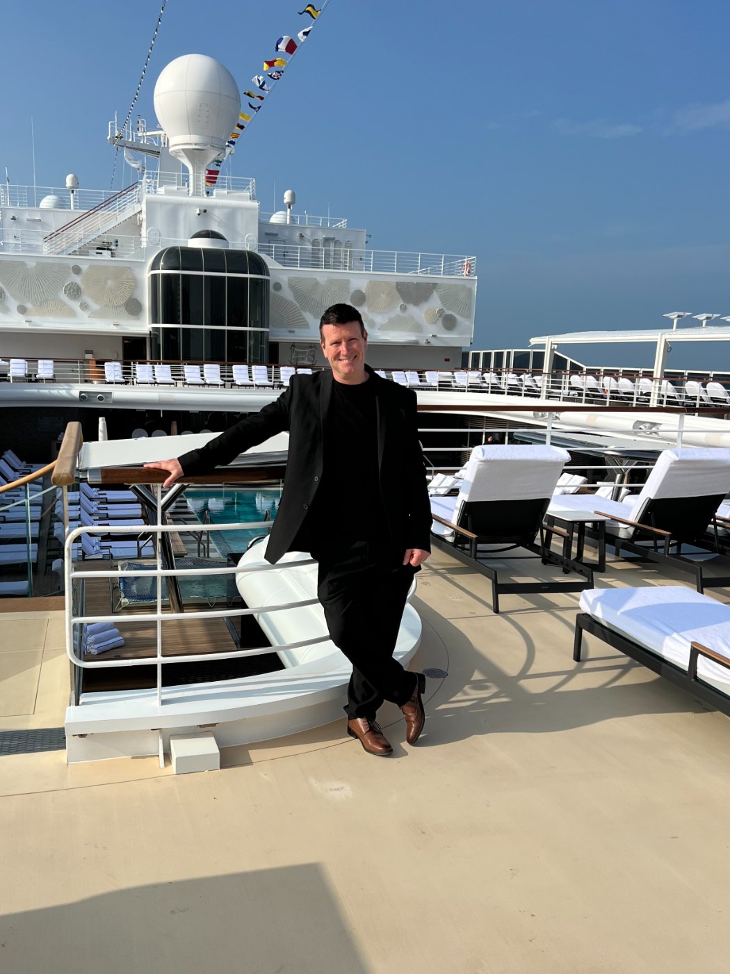 DJ Steve B on the pool deck of a cruise ship at sea