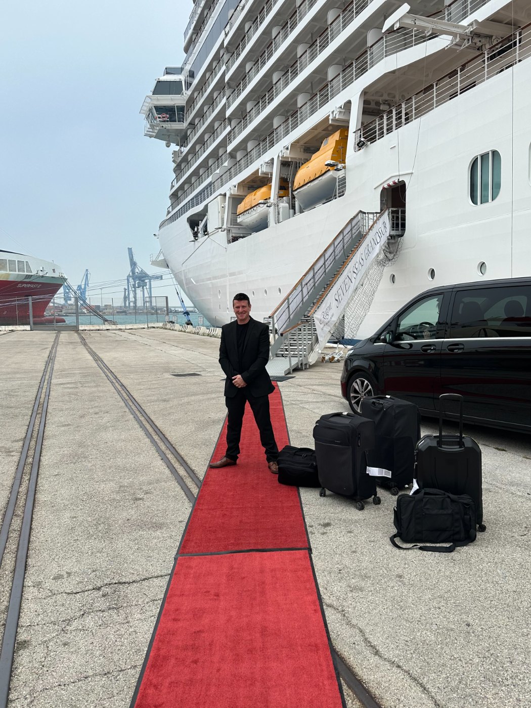 DJ Steve B on the red carpet at the gangway of the Seven Seas Grandeur
